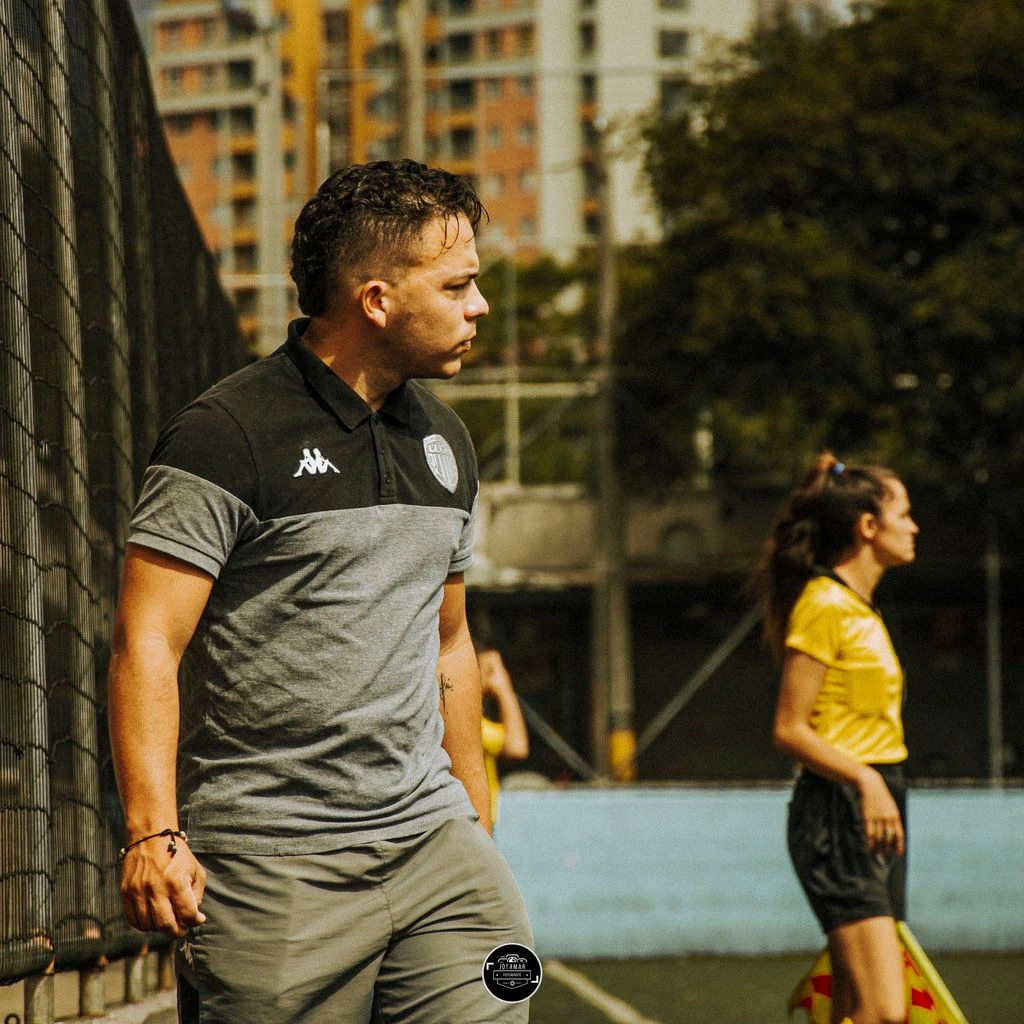 Girls' Academy Head Coach by a youth goal